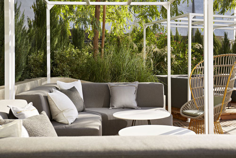 cabana with lounge chairs and tables