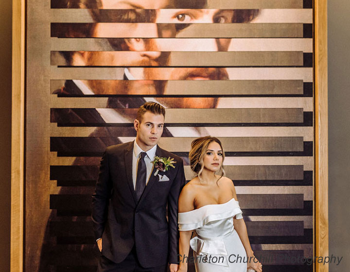 Bride & Groom in front of art