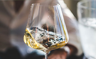 swirling white wine in a glass
